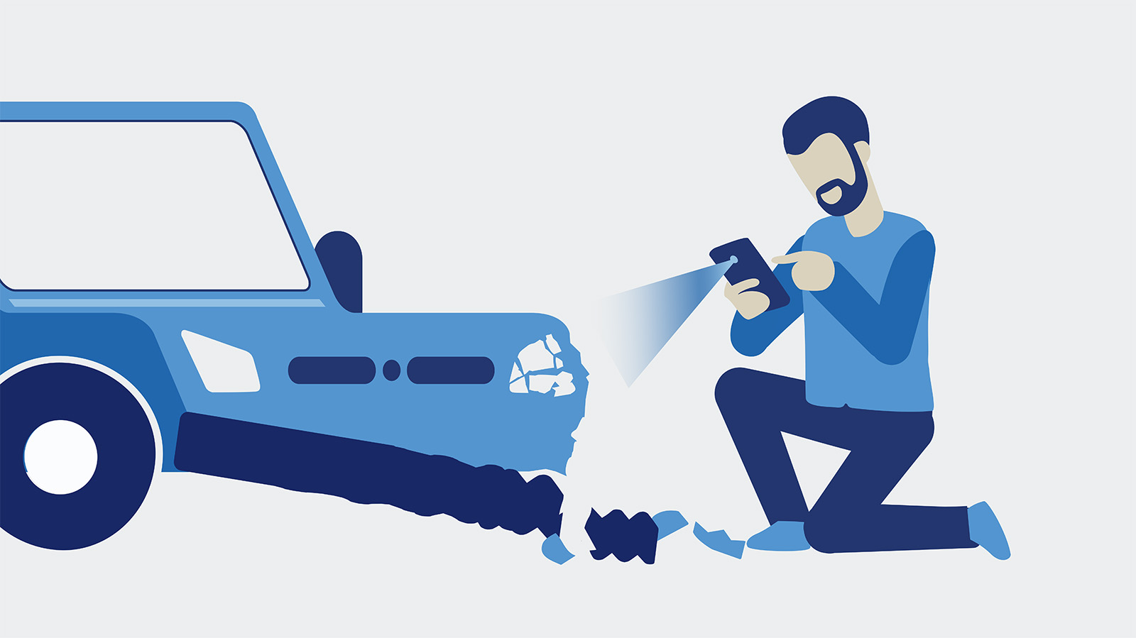 Mann kniet vor Auto und fotographiert Schaden