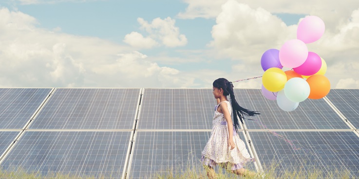 Solar pannels and a girl with baloons
